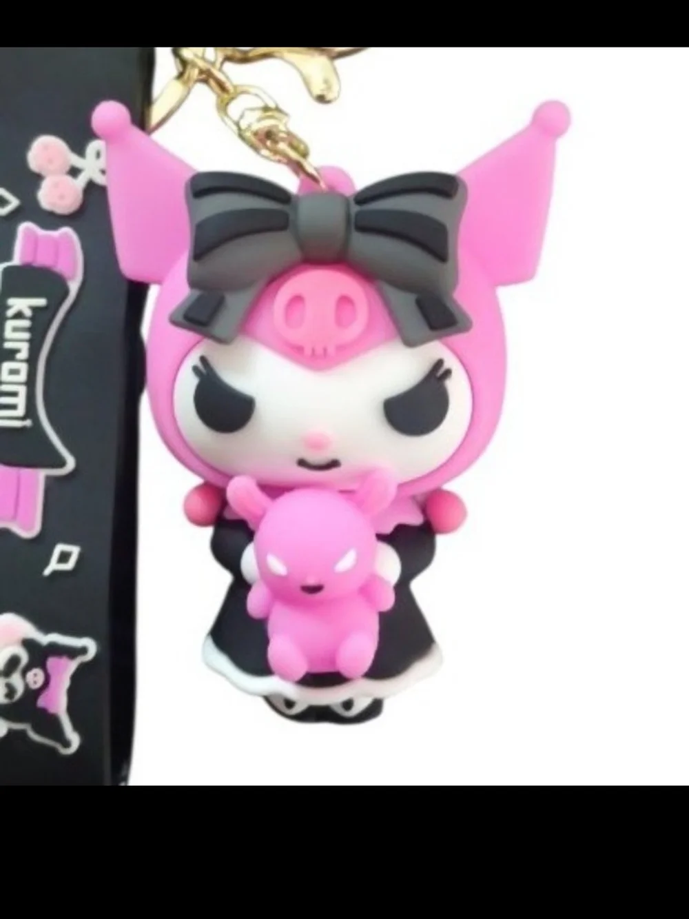 Sanrio Kuromi keychain features Kuromi holding a small pink teddy bear